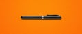 Black felt pen isolated on orange banner Royalty Free Stock Photo
