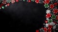 A black felt surface with poker chips scattered around the outside edge of the frame. On a dark black background. T Royalty Free Stock Photo