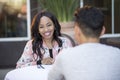 Interracial Blind Date in Outdoor Restaurant Royalty Free Stock Photo