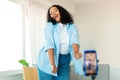 Black Female Blogger Making Video On Smartphone Dancing At Home