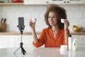 Black Female Blogger Recording Cosmetic Review Video At Home With Smartphone Royalty Free Stock Photo