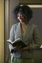 Black African American Female Businesswoman with a Book