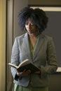 Black African American Female Businesswoman with a Book