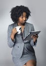 Black Female Businesswoman Keynote Speaker Posing with a Tablet and Coffee