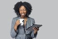 Black Female Businesswoman Keynote Speaker Posing with a Tablet and Coffee