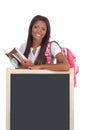 Black female College student by blackboard Royalty Free Stock Photo