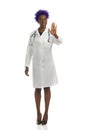 Black Female Doctor Is Standing With Hand Raised And Showing Stop Hand Sign. Full Length Isolated Royalty Free Stock Photo