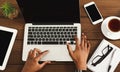 Black female hands on laptop keyboard, top view