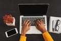 Black female hands working on laptop, top view Royalty Free Stock Photo