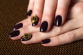 Black female manicure nails closeup with crown