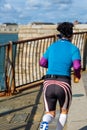 A black female runner or jogger in exercise clothing