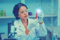 Black female scientist or doctor in protective glasses and gloves test tube antivirus,in laboratory,concept research sample