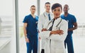 Black female standing in front of team