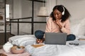 Black Female Student Taking Notes Using Laptop Learning At Home Royalty Free Stock Photo