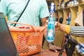 black female supermarket attendant using a barcode scanner to checkout a customer& x27;s item