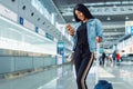 Black female tourist in international airport