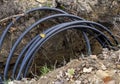 Black fiber optic cables for internet lying in the ground. Electricity and phone cable. Cable Installation power lines Royalty Free Stock Photo