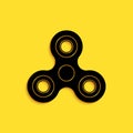 Black Fidget spinner icon isolated on yellow background. Stress relieving toy. Trendy hand spinner. Long shadow style