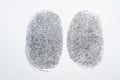 Black fingerprint on white paper