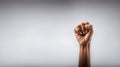 Black fist by woman hand closeup over white background copy space. Generative AI Royalty Free Stock Photo