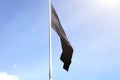 Black flag waving high in sky Royalty Free Stock Photo