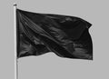 Black flag waving in the wind on flagpole Royalty Free Stock Photo