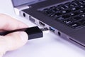 Black flash disk with laptop USB slot Royalty Free Stock Photo