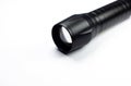 Black Flashlight on the white background. Close up Royalty Free Stock Photo