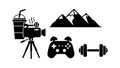 Black flat icon set including mountain peaks, video camera filming, gaming controller, dumbbell weight, and beverage cup with Royalty Free Stock Photo