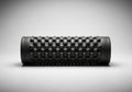 A black foam roller with a textured grid pattern across its surface, Royalty Free Stock Photo