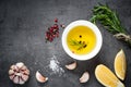 Black food background with olive oil and spices Royalty Free Stock Photo