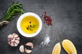 Black food background with olive oil and spices Royalty Free Stock Photo