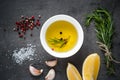 Black food background with olive oil and spices Royalty Free Stock Photo