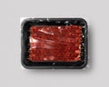 Black Food packaging with bacon grill stick top view