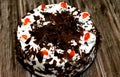 A black forest cake, a light chocolate sponge cake, soaked with cherry syrup and cherry brandy Royalty Free Stock Photo