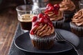Black forest cupcake with whipped ganache and cherry topping Royalty Free Stock Photo