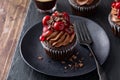 Black forest cupcake with whipped ganache and cherry topping Royalty Free Stock Photo