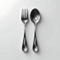 Engraved fork and spoon with swirling texture on white Royalty Free Stock Photo