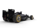 Black formula one car - tail view