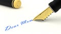 Black fountain pen writing the words dear mom Royalty Free Stock Photo