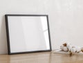 Black frame in cozy light minimalist living room interior close up