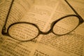 Black frame glasses are placed on the Chinese-English Bible Royalty Free Stock Photo