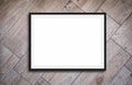 Black frame mockup on for picture or text, wooden background