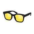 Black-framed glasses with yellow-tinted lenses, featuring a classic, rectangular shape Royalty Free Stock Photo