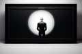 a black framed picture of a man standing in front of a light Royalty Free Stock Photo