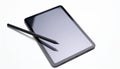 Black Framed Tablet with Stylus on White Background in a Flat Lay Studio Shot Royalty Free Stock Photo