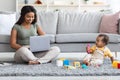 Black Freelancer Woman Working Remotely From Home And Taking Care About Baby Royalty Free Stock Photo