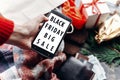 Black friday big sale special offer. woman holding phone with di Royalty Free Stock Photo