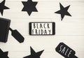 Black Friday big sale text on phone screen. Special discount christmas offer. Phone with advertising message at gift boxes and pr Royalty Free Stock Photo