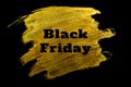 Black friday. Black lettering on gold Royalty Free Stock Photo